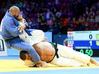 Adam Okruashvili (white) and Guram Tushishvili (blue)fight during the men's over 100kg competition during the European Judo Championship in...