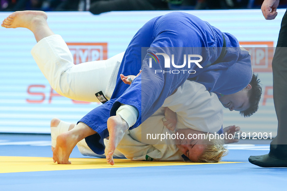 Maryna Slutskaya from Belarus (blue) fights with Ukrainian Svitlana Iaromka (white) in women over 78kg competition during the European Judo...