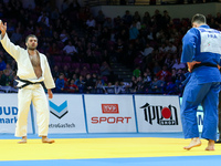 French Cyrille Maret (blue) fights with Elkhan Mammadov (white) from Azerbaijan during men under 100kg competition during the European Judo...