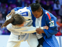 French Audrey Tcheumeo ( blue) fights with Nederland's Guusje Steenhuis (white) during final fight of women under 78kg competition during th...