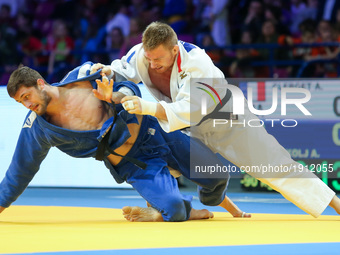 Serbian Aleksandar Kukolj (blue) fights with French Axel Clerget (white) during men under 90kg competition during the European Judo Champion...