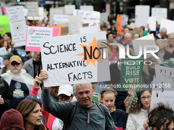 Protestors hold up signs opposing conservative standpoints of the Trump-Administration regarding science and the environment. Thousands part...