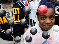 Claudia Levin-Dorko ,9, of Philadelphia, shows a model of a Melanin molecule as he participates with his family in the National March for Sc...