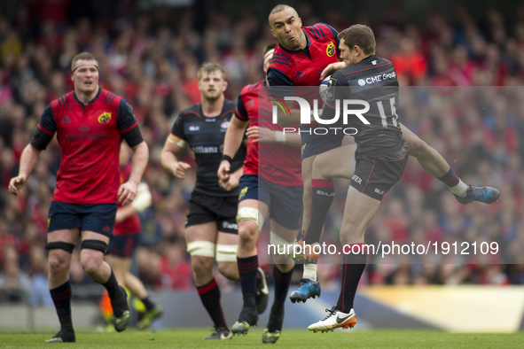 Simon Zebo of Muster and Alex Goode of Saracens battle for the ball during the European Rugby Champions Cup Semi-Final match between Munster...