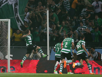 Sporting's Portuguese midfielder Adrien Silva (L) celebrates after scoring a goal  during the Portuguese League football match Sporting CP v...