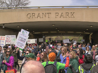 Protesters march with signs during the March for Science at Museum Campus in Chicago, Illinois, USA on April 24, 2012.  (