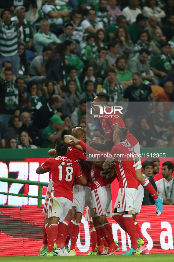 Benfica's Swedish defender Victor Lindelof celebrates with teammates after scoring during the Portuguese League football match Sporting CP v...