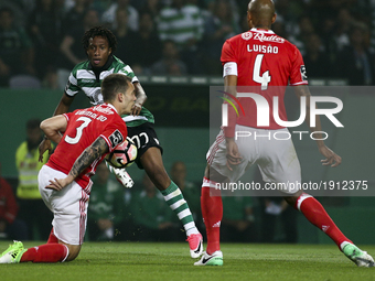 Sporting's forward Gelson Martins (2ndL) vies with Benfica's Spanish defender Alex Grimaldo during the Portuguese League  football match bet...