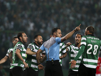 Portuguese referee Artur Soares Dias signs penalty kick during the Portuguese League  football match between Sporting CP and SL Benfica at J...
