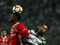 Benfica's midfielder Nelson Semedo (L) vies with Sporting's forward Bruno Cesar during the Portuguese League  football match between Sportin...