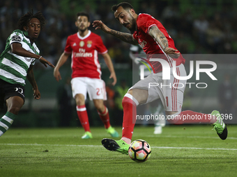 Benfica's Greek forward Konstantinos Mitroglou (R) vies with Sporting's forward Gelson Martins during the Portuguese League  football match...