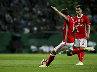 Benfica's Swedish defender Victor Lindelof scores a goal during the Portuguese League  football match between Sporting CP and SL Benfica at...