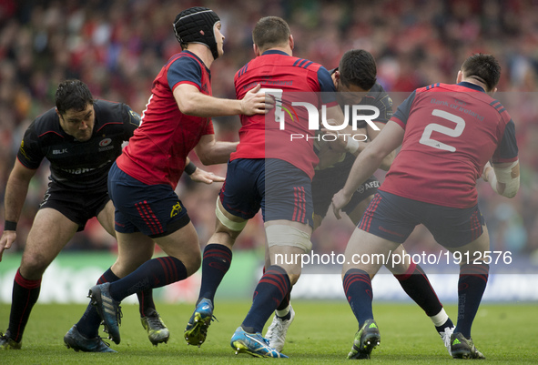 Sean Maitland of Saracens tackled by Tyler Bleyendaal, Tommy O'Donnell and Niall Scannell of Munster during the European Rugby Champions Cup...