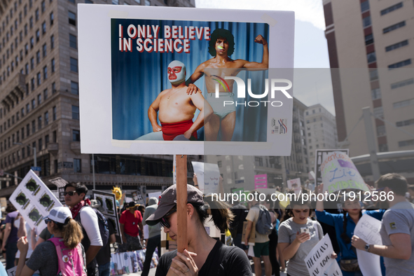 People take part in the March for Science in Los Angeles, California on April 22, 2017. The event which coincides with Earth Day was held in...