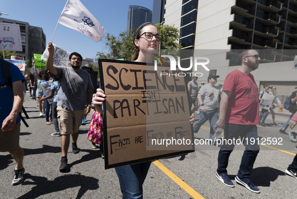 People take part in the March for Science in Los Angeles, California on April 22, 2017. The event which coincides with Earth Day was held in...