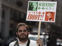 A protester holds a anti-Trump sign during the March for Science in Los Angeles, California on April 22, 2017. The event which coincides wit...