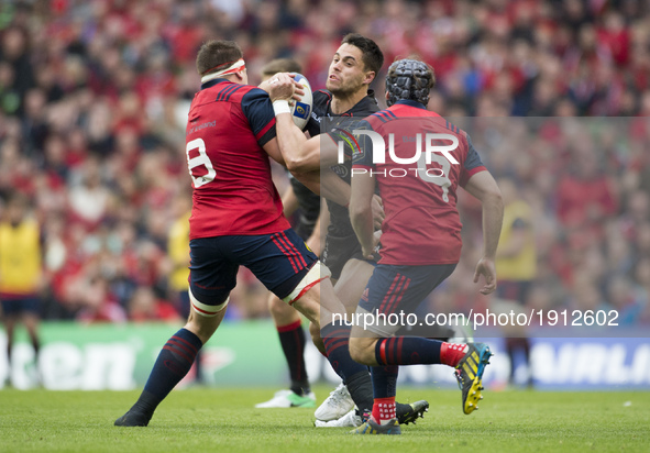 Sean Maitland of Saracens tackled by CJ Stander and Duncan Williams during the European Rugby Champions Cup Semi-Final match between Munster...
