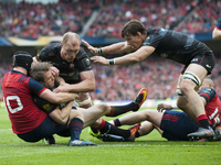 Chris Wyles of Saracens tackled by Tyler Bleyendaal of Munster during the European Rugby Champions Cup Semi-Final match between Munster Rugb...