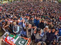 Kashmiri Muslims offer the funeral prayers in front the body of  Younis Maqbool Ganie, a pro Kashmir rebel killed in a gun battle with India...