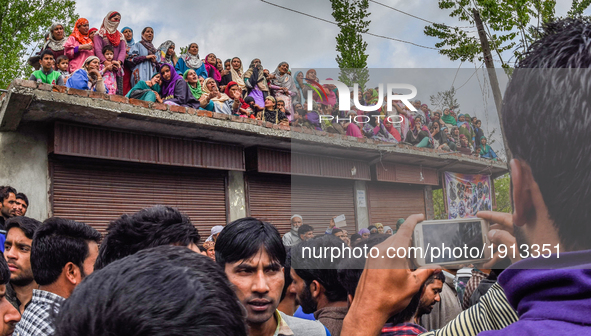 Kashmiri Muslim women attend the funeral procession of   Younis Maqbool Ganie, a pro Kashmir rebel killed in a gun battle with Indian govern...