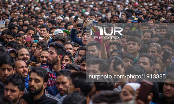 Kashmiri Muslims attend the funeral procession of   Younis Maqbool Ganie, a pro Kashmir rebel killed in a gun battle with Indian government...