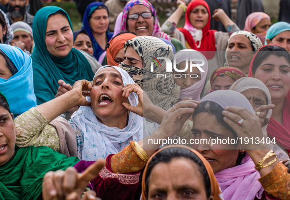 Kashmiri Muslim women shout anti Indian and pro Kashmir freedom slogans as they attend the funeral procession of   Younis Maqbool Ganie, a p...