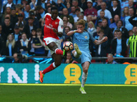 Arsenal's Danny Welbeck beats Manchester City's Kevin De Bruyne during The Emirates FA Cup - Semi-Final match between Arsenal and Manchester...