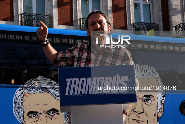 Left-wing party Podemos leader Pablo Iglesias speaks as the 'Tramabus,' an anti-corruption bus belonging to the Spanish opposition party Pod...