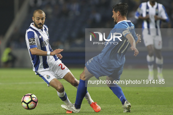 Porto's Portuguese midfielder Andre Andre (L) compete the ball with Feirense player Cris (R) during the Premier League 2016/17 match between...