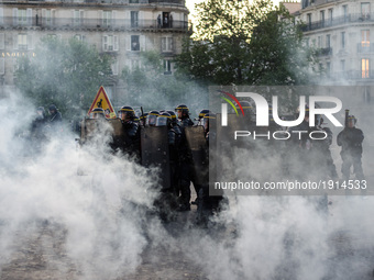 Anti-fascists clash with police forces as they demonstrate in Place de la Bastille and Place de la Republique in Paris, on April 23, 2017 fo...