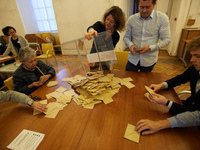 Volunteers count the ballots at the end of the first round of the French presidential election first round vote in Toulouse,  France on Apri...