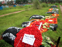 Dhaka, Bangladesh. April 24, 2017. Relatives of Rana plaza victims and social activists pay tribute at a graveyard in Dhaka on April 24, 201...