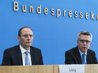 German Interior Minister Thomas de Maiziere (R) and Saxony's Interior Minister Markus Ulbig (L) are pictured during a press conference to pr...