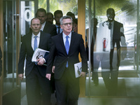 German Interior Minister Thomas de Maiziere (C-R) and Saxony's Interior Minister Markus Ulbig (C-L) arrive to a press conference to present...