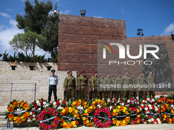 Israeli soldiers stand guard during a ceremony marking the annual Holocaust Remembrance Day at the Yad Vashem Holocaust memorial in Jerusale...