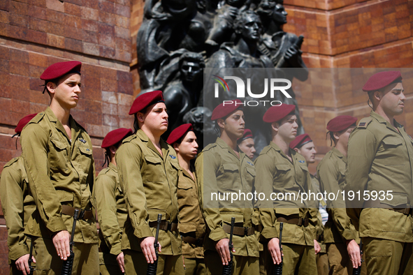 Israeli soldiers take part in a ceremony marking the annual Holocaust Remembrance Day at the Yad Vashem Holocaust memorial in Jerusalem, Isr...