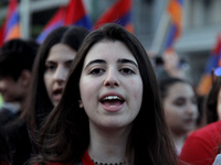 Young Armenians shout slogans against the Turks close to the Turkish embassy in central Athens, on Monday April 24, 2017. Hundreds of Armeni...