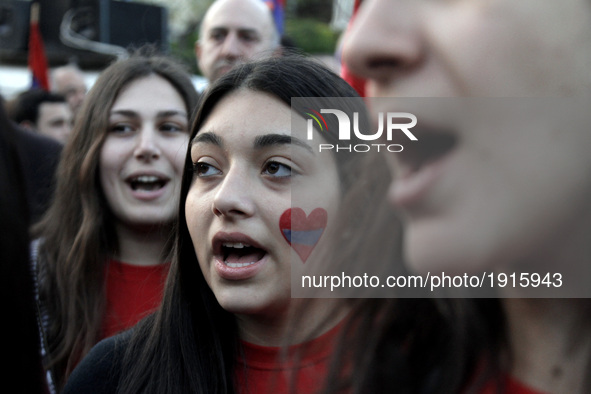 Young Armenians shout slogans against the Turks close to the Turkish embassy in central Athens, on Monday April 24, 2017. Hundreds of Armeni...
