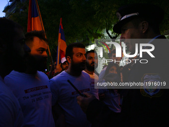 Members of the Armenian community demonstrate outside the Turkish consulate, during a rally to commemorate the 102nd anniversary of the Arme...