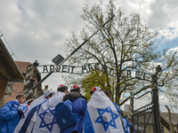 Participants of the annual March of the Living at the entrance gate to the former German Nazi Death Camp Auschwitz.
Jewish people from Israe...