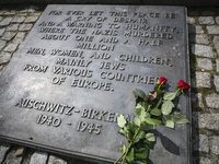 Plaque with English words at International Monument at the former Nazi-German Auschwitz Birkenau concentration and extermination camp at Osw...