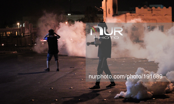 Bahrain , Sitra - heavy clashes between protesters and riot police after suppressing a peacefull demonstration in solidarity with Gaza in Si...