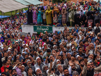 Kashmiri Muslims  pray as a head priest displays the holy relic believed to be the whisker from the beard of the Prophet Mohammed on the occ...