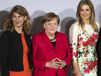 German Chancellor Angela Merkel (C), Queen Maxima of the Nehterlands (R) and President of the Association of German Women Stephanie Bschorr...