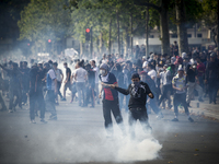 Pro-Palestinian protesters during clashes at Place de La Republique, during a banned demonstration in support of Gaza, in Paris, France, Sat...