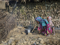 A Rohingya woman cooks food outside her makeshift home in Kutupalong newly expanded Refugee Camp.  Approximately 70,000 Rohingya Muslims hav...