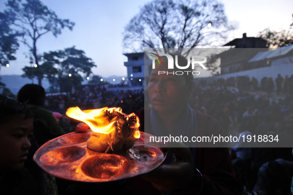 Devotees offering butter lamps during the Mother's Day celebration at Matatritha temple in Kathmandu, Nepal on Wednesday, April 26, 2017. Mo...