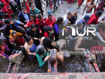Devotees taking ritual holy bath during the Mother's Day to perform puja at Matatritha temple in Kathmandu, Nepal on Wednesday, April 26, 20...
