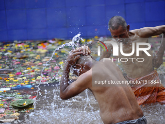 Devotees taking ritual holy bath during the Mother's Day to perform puja at Matatritha temple in Kathmandu, Nepal on Wednesday, April 26, 20...