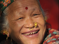 A Smilling portrait of 59yrs old, KHILA KUMARI TAMANG, arrives from Nuwakot in a traditional attire and ornaments to offer ritual puja at Ma...